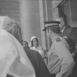 TUA80 Dental nurses from all over the country marched to Parliament in March 1974, to pressure the Government to restore their wage relativity with public health nurses. MPs were heard to comment: “It’s marvellous. They are so neat and tidy.” In any event they won relativity. Nurses try to gain access to Parliment buildings<br /><br />KEITH STEWART TUA80