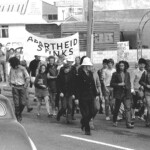 Anti-Apartheid Protest in 1971 at Brighton Beach Christchurch. Owen Wilkes in centre carrying daughter Koa and with Joan Wilkes