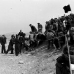 300 demonstrators, mostly young and students gathered from all over New Zealand at the Post Office in Timaru, on the East Coast of the South Island, They marched from there along the waterfront to Caroline Bay, a distance of about one mile.
From Caroline Bay the demonstrators moved out of town to Washdyke, about 3 miles to the north the site of the logistic end supply base for the Mt. John installation.