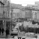 In Wellington workers stop work and march to the Employers Federation office protesting about the use of injunctions preventing workers withdrawing there labour. The march was also in solidarity with Bill Andersen imprisoned for defying a Supreme Court injunction.