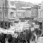 In Wellington workers stop work and march to the Employers Federation office protesting about the use of injunctions preventing workers withdrawing there labour. The march was also in solidarity with Bill Andersen imprisoned for defying a Supreme Court injunction.