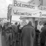 In Wellington workers stop work and march to the Employers Federation office protesting about the use of injunctions preventing workers withdrawing there labour. The march was also in solidarity with Bill Andersen imprisoned for defying a Supreme Court injunction.