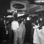 American Independence Day ball in 1973 at the Majestic Cabaret, Willis St, Wellington. Demonstrators voice their disagreement with USA involvement in the Vietnam war.