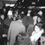 American Independence Day ball in 1973 at the Majestic Cabaret, Willis St, Wellington. Demonstrators voice their disagreement with USA involvement in the Vietnam war.
