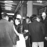 American Independence Day ball in 1973 at the Majestic Cabaret, Willis St, Wellington. Demonstrators voice their disagreement with USA involvement in the Vietnam war.