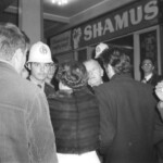 American Independence Day ball in 1973 at the Majestic Cabaret, Willis St, Wellington. Demonstrators voice their disagreement with USA involvement in the Vietnam war.