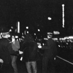 American Independence Day ball in 1973 at the Majestic Cabaret, Willis St, Wellington. Demonstrators voice their disagreement with USA involvement in the Vietnam war.