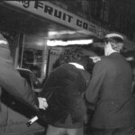 American Independence Day ball in 1973 at the Majestic Cabaret, Willis St, Wellington. Demonstrators voice their disagreement with USA involvement in the Vietnam war.