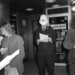 American Independence Day ball in 1973 at the Majestic Cabaret, Willis St, Wellington. Demonstrators voice their disagreement with USA involvement in the Vietnam war.