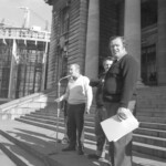 Workers from the Seamens Union and Drivers Union marched to Parliament in June 1974. They were protesting about a number of issues including cost of living and anti-union legislation being introduced that allowed injunctions on Unions supporting other unions. Dave Morgan (Seamens Union) speaking to the crowd. Ken Douglas with papers in hand