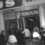 American Independence Day ball in 1973 at the Majestic Cabaret, Willis St, Wellington. Demonstrators voice their disagreement with USA involvement in the Vietnam war.