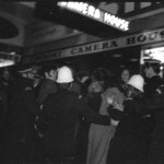 American Independence Day ball in 1973 at the Majestic Cabaret, Willis St, Wellington. Demonstrators voice their disagreement with USA involvement in the Vietnam war.