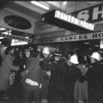 American Independence Day ball in 1973 at the Majestic Cabaret, Willis St, Wellington. Demonstrators voice their disagreement with USA involvement in the Vietnam war.