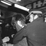 American Independence Day ball in 1973 at the Majestic Cabaret, Willis St, Wellington. Demonstrators voice their disagreement with USA involvement in the Vietnam war.