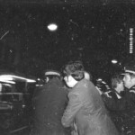 American Independence Day ball in 1973 at the Majestic Cabaret, Willis St, Wellington. Demonstrators voice their disagreement with USA involvement in the Vietnam war.