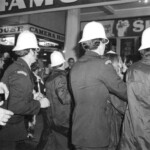 American Independence Day ball in 1973 at the Majestic Cabaret, Willis St, Wellington. Demonstrators voice their disagreement with USA involvement in the Vietnam war.