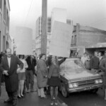 In Wellington workers stop work and march to the Employers Federation office protesting about the use of injunctions preventing workers withdrawing there labour. The march was also in solidarity with Bill Andersen imprisoned for defying a Supreme Court injunction.