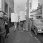 In Wellington workers stop work and march to the Employers Federation office protesting about the use of injunctions preventing workers withdrawing there labour. The march was also in solidarity with Bill Andersen imprisoned for defying a Supreme Court injunction.