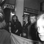 American Independence Day ball in 1973 at the Majestic Cabaret, Willis St, Wellington. Demonstrators voice their disagreement with USA involvement in the Vietnam war.