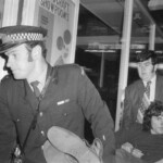 American Independence Day ball in 1973 at the Majestic Cabaret, Willis St, Wellington. Demonstrators voice their disagreement with USA involvement in the Vietnam war.