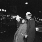 American Independence Day ball in 1973 at the Majestic Cabaret, Willis St, Wellington. Demonstrators voice their disagreement with USA involvement in the Vietnam war.