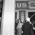 American Independence Day ball in 1973 at the Majestic Cabaret, Willis St, Wellington. Demonstrators voice their disagreement with USA involvement in the Vietnam war.