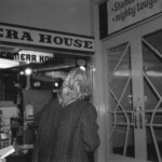 American Independence Day ball in 1973 at the Majestic Cabaret, Willis St, Wellington. Demonstrators voice their disagreement with USA involvement in the Vietnam war.