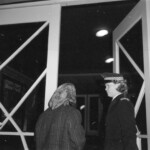 American Independence Day ball in 1973 at the Majestic Cabaret, Willis St, Wellington. Demonstrators voice their disagreement with USA involvement in the Vietnam war.