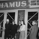 American Independence Day ball in 1973 at the Majestic Cabaret, Willis St, Wellington. Demonstrators voice their disagreement with USA involvement in the Vietnam war.