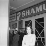 American Independence Day ball in 1973 at the Majestic Cabaret, Willis St, Wellington. Demonstrators voice their disagreement with USA involvement in the Vietnam war.
