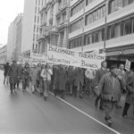 In Wellington workers stop work and march to the Employers Federation office protesting about the use of injunctions preventing workers withdrawing there labour. The march was also in solidarity with Bill Andersen imprisoned for defying a Supreme Court injunction.