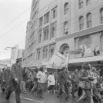 In Wellington workers stop work and march to the Employers Federation office protesting about the use of injunctions preventing workers withdrawing there labour. The march was also in solidarity with Bill Andersen imprisoned for defying a Supreme Court injunction.