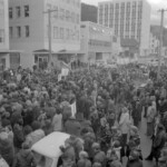 In Wellington workers stop work and march to the Employers Federation office protesting about the use of injunctions preventing workers withdrawing there labour. The march was also in solidarity with Bill Andersen imprisoned for defying a Supreme Court injunction.