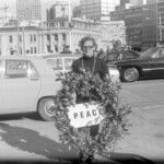 Progressive Youth Movement (PYM) Wellington members attend a wreath laying ceremony at the Wellington Cenotaph. Wreaths were laid by representatives of armed forces. The PYM laid a wreath to PEACE . Roger Cruickshank with the wreath to be laid.
